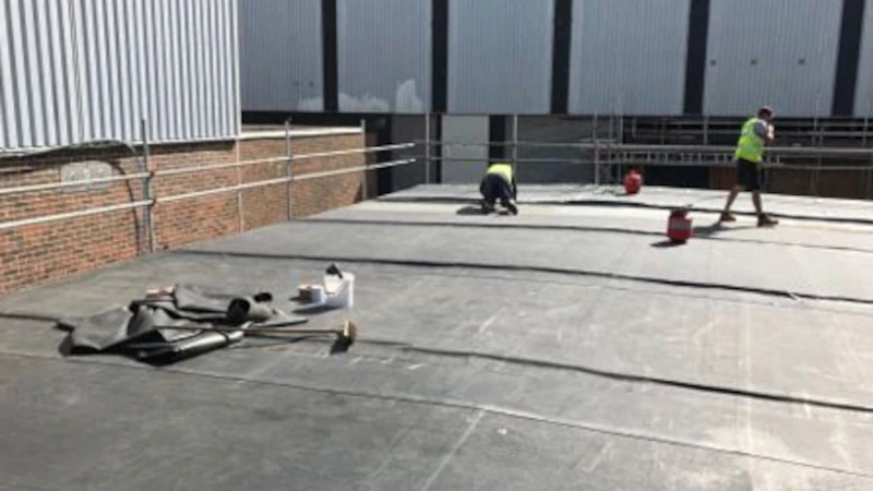 Commercial roofing repairs performed on a flat roof